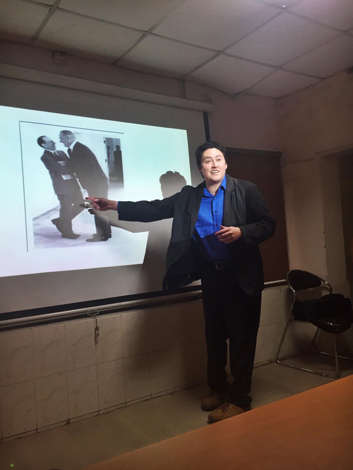 Pic of Delivering a lecture at Ambedkar University Delhi (located in New Delhi) about U.S. food aid to India during the 1960s